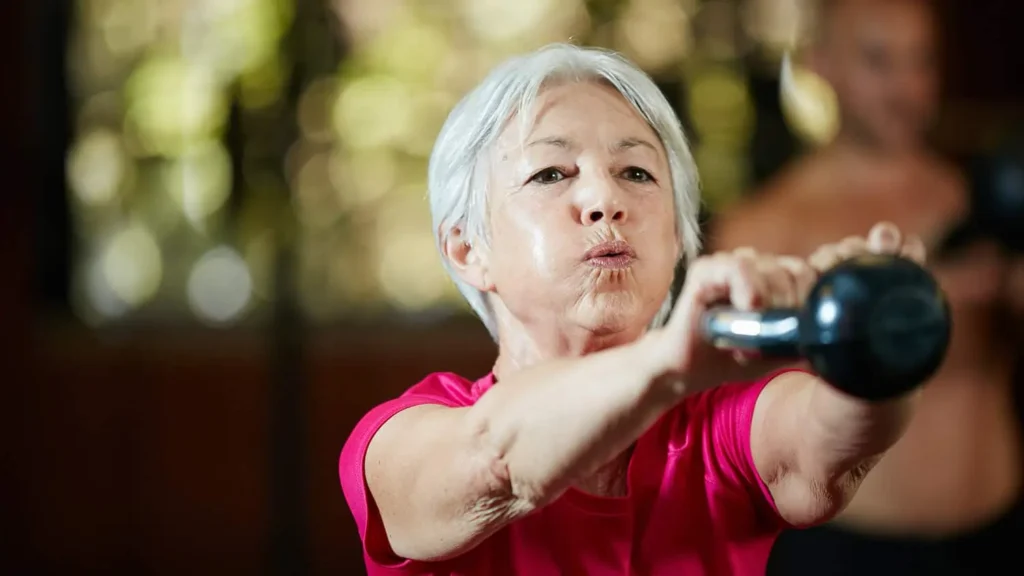 Toning Bingo Wings: Effective Exercises and Tips for Achieving Sleeker Arms 2 Person performing arm exercises with dumbbells Northolt